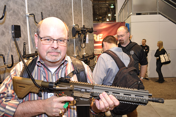 Here I am at the 2015 SHOT Show, posing with a Heckler and Koch 416 assault rifle. This is Jonathan Grave's main firearm and is referred to in the books by its Marine Corps designation of the M27.