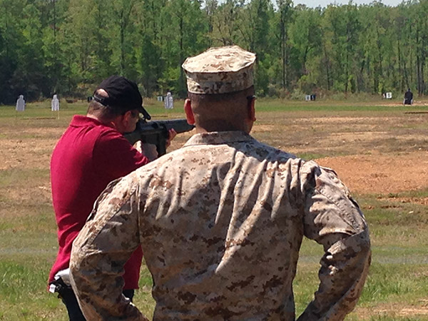  I was invited to Marine Corps Base Quantico (Virginia) to play with captured weapons. Here I am firing a Heckler and Koch G3 assault rifle. Notice the attentive range safety officer.