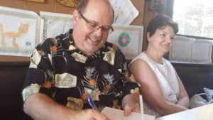 Here I am signing book next to my lovely bride, Joy.