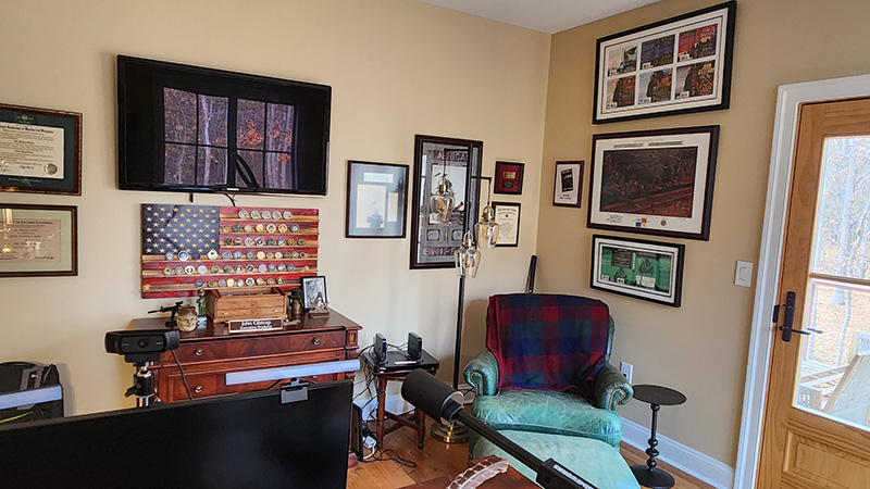 Photo of a chair, a door, and various framed pieces